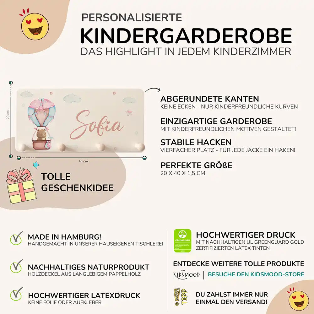 detailansicht der gravierten ballon bär motive auf der holzgarderobe