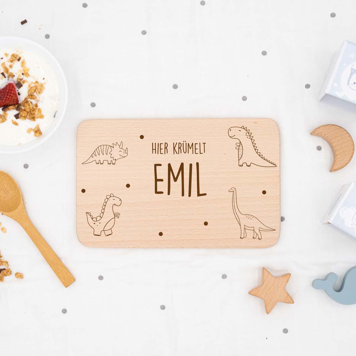 custom dinosaur design on wooden breakfast board