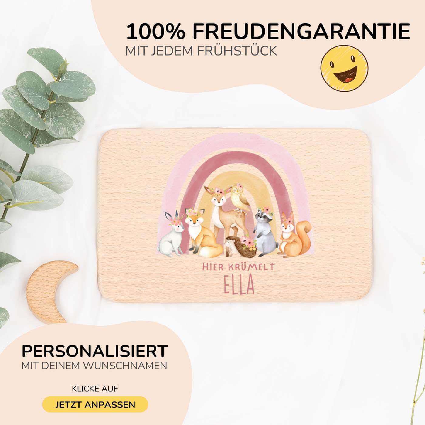 nahaufnahme des frühstücksbrettchens mit regenbogen-waldtiere motiv