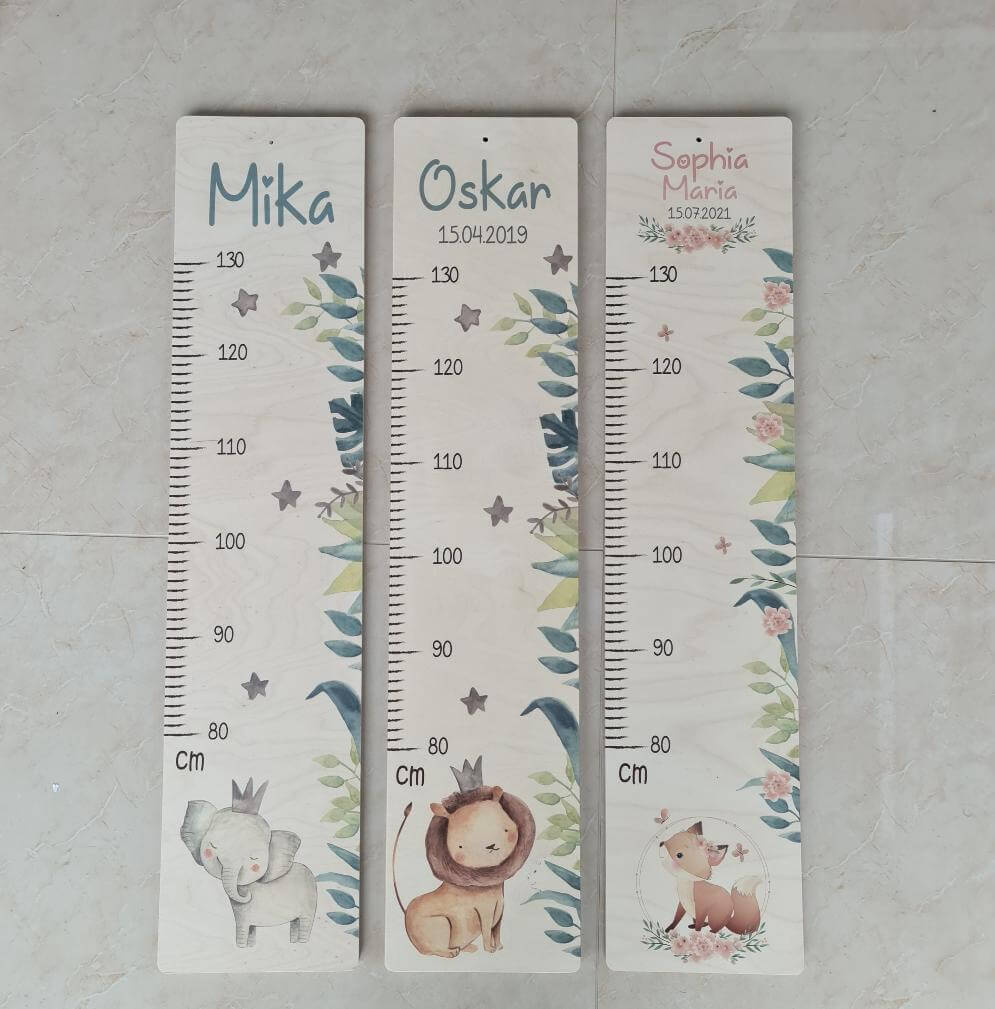handcrafted height chart with lion engraving