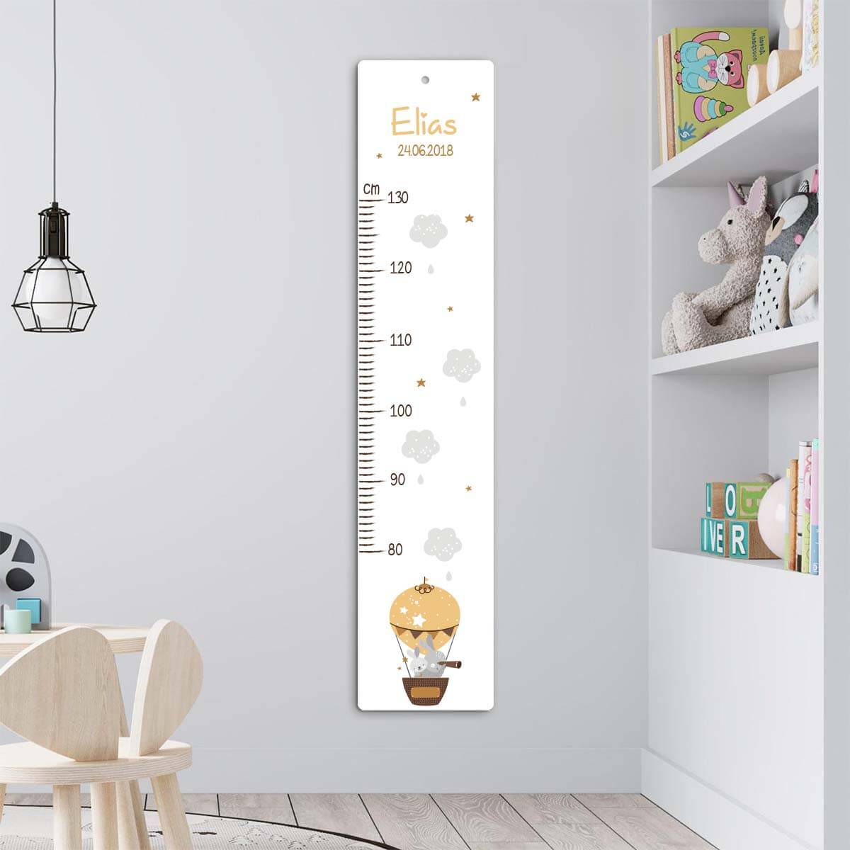 close-up of animal illustrations on growth chart with balloon